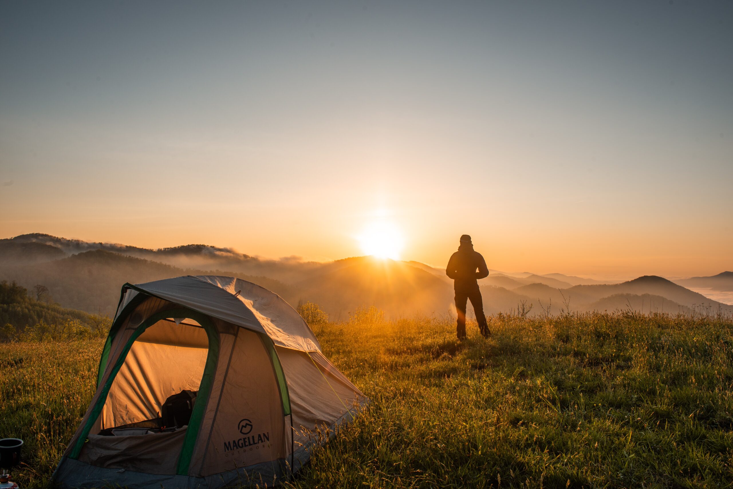 Man Camping Looking At Sunset lifelivedbetter