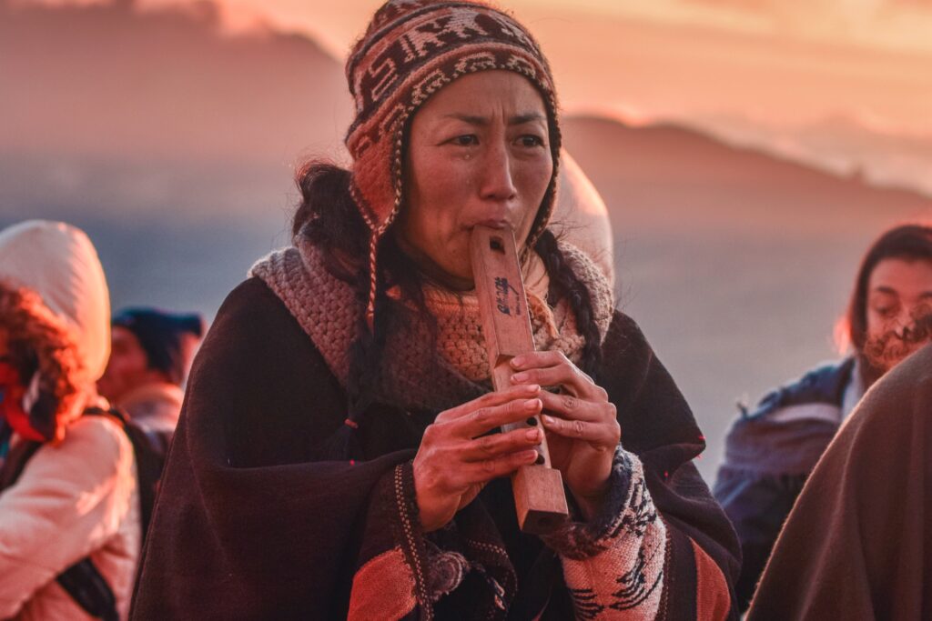 South American Native Playing Traditional Music. Listening To Music